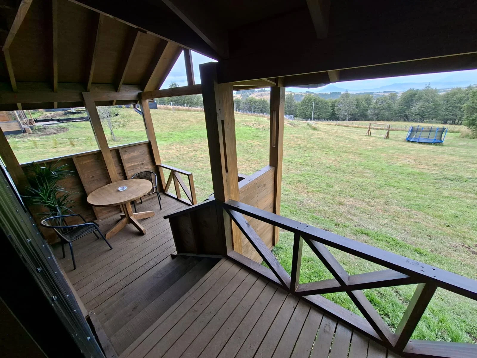 Terrace looking onto the greenery. Small cabin at Tinaja Bellavista Coyhaique.